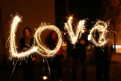 The word 'love' spelled with sparklers