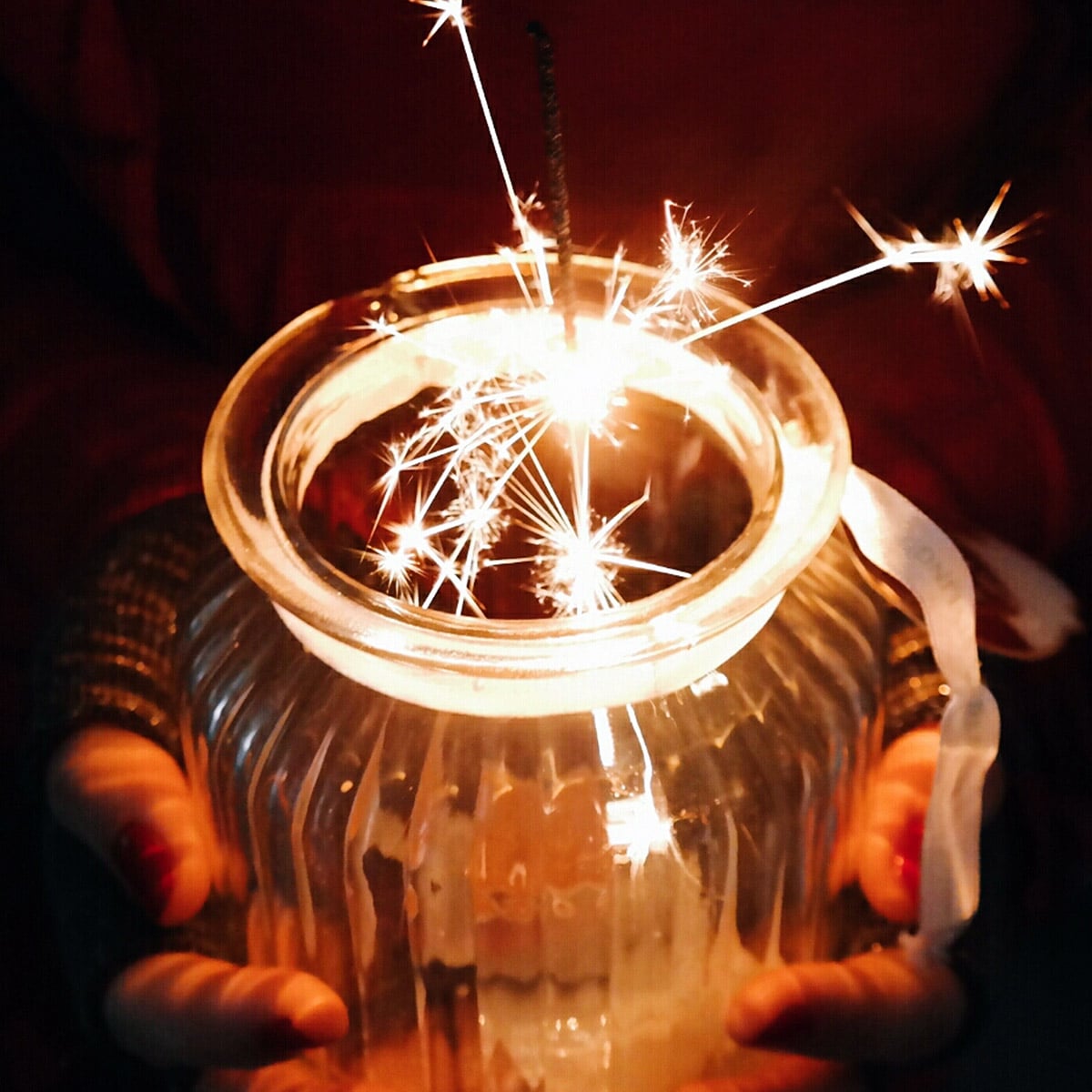 Sparkler burning in a small vase
