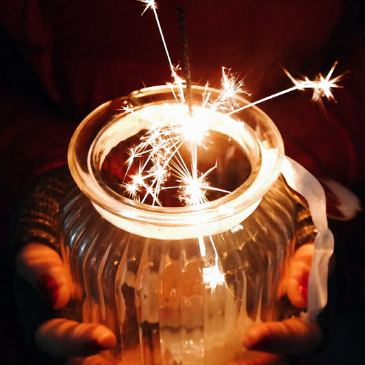 Sparkler burning in a small vase